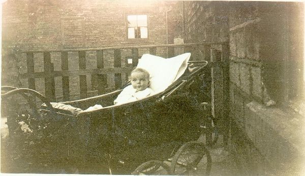 Edna Holden, as baby in pram 1928/9. Good pram pic of time Taken ? in Ducie Street Ram, but no street detail. 
to be catalogued
Keywords: 1985
