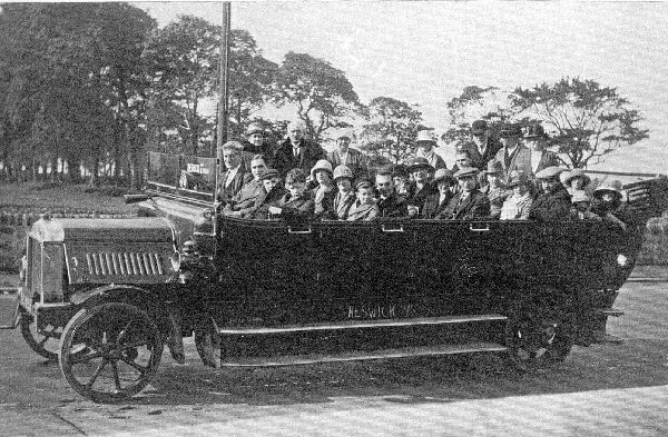 Charabanc trip from Ramsbottom 1924. Keswick 8/6 chalked on side of vehicle & Keswick chalked on windscreen. Too far for day trip. Maybe a longer trip or Keswick -co. name? 
to be catalogued
Keywords: 1985