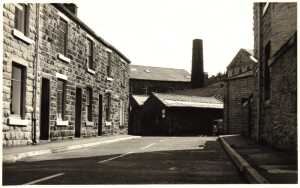 Looking south along Silver St, Ramsbottom, towards Old Ground Mill on Square St, weaving shed in the foreground. Note the rear view of the upper storey of the Baptist Chapel on Bolton St, to the right of the mill’s square chimney. Taken 1974 or before
17-Buildings and the Urban Environment-05-Street Scenes-031 Bolton Street
Keywords: 1985