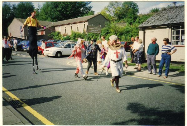 Stilt walker lead medieaval parade on Carr Street
17-Buildings and the Urban Environment-05-Street Scenes-006-Carr Street and Tanners area
Keywords: 1995