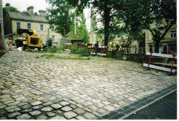 Trees being cut down in Market Place 
17-Buildings and the Urban Environment-05-Street Scenes-017-Market Place
Keywords: 1997