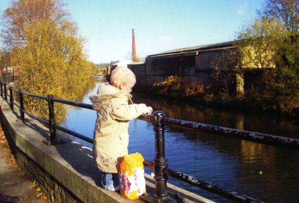 Child feeding the ducks at Ramsbottom Wharf 
17-Buildings and the Urban Environment-05-Street Scenes-021-Peel Brow area

Keywords: 2007
