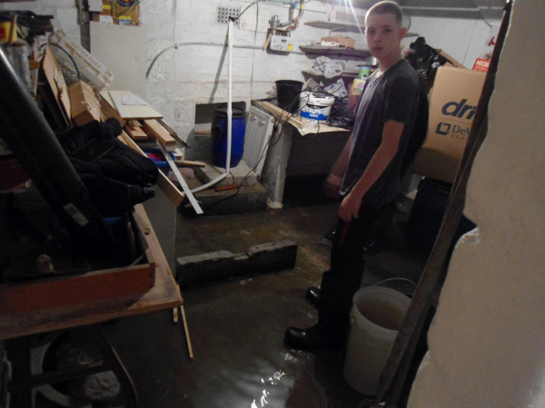 Mopping out Great-grandad's cellar after flood 12 BRW 
09-People and Family-02-People-000-General
Keywords: 2023