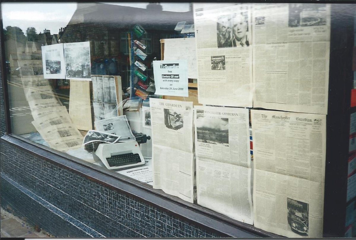 Market Place News  - Second window decorated for Millenium Festival catalogued at Bury Archives as RHS/21/3/2/33
03 - Shops, Restaurants & Hotels - 02 - Individual shops
Keywords: Bury-Archive