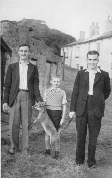 Mr H.H. Duckworth with fox he had shot, July 1947 Pic includes H.H.D's brother-in-law & a boy.  Said to.be first fox caught in RUDC. 
09 - People and Family - 01 - Families
Keywords: Bury-Archive