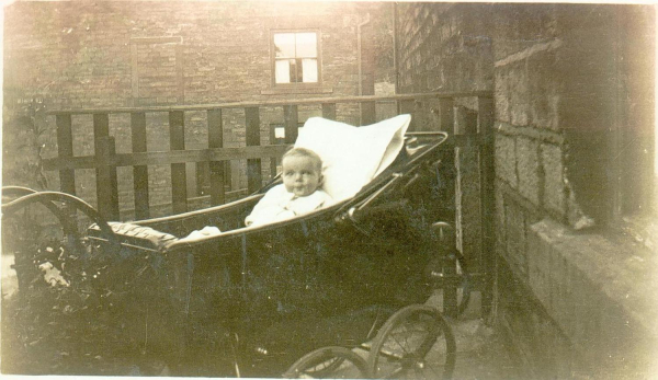 Edna Holden, as baby in pram 1928/9. Good pram pic of time Taken ? in Ducie Street Ram, but no street detail. 
09 - People and Family - 01 - Families
Keywords: Bury-Archive