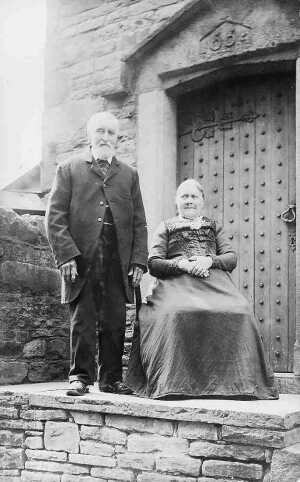 Joseph and Sarah walker outside the School House in Dundee Lane.  C. 1900 
people
Keywords: 1945