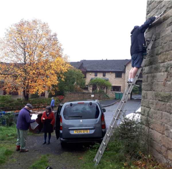 Gutter Lane sign being erected by John and Michael Ireland
01-Ramsbottom Heritage Society-01-RHS Activities-014-Blue Plaques and Signs
Keywords: 2021