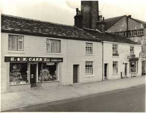 Shops by Spencer's Engraving Works, Bolton Road West. 1958.  Endorsement 'not shown' [ie this print was not shown to the customer] 
17-Buildings and the Urban Environment-05-Street Scenes-002-Bolton Road West
Keywords: 0